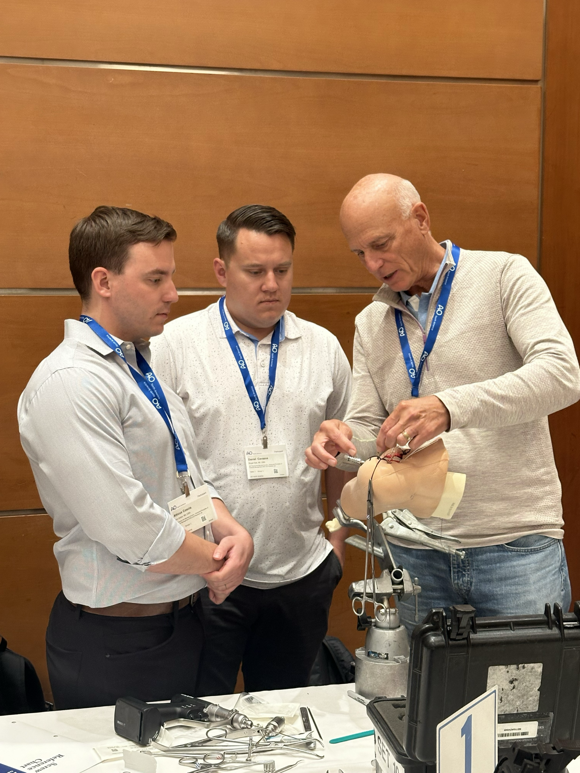 Orthopedic fellows discussing fracture cases